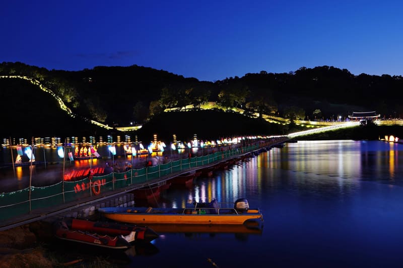 Lights along the Geumgang River below Gongsanseong Fortress at night during the 70th Baekje Cultural Festival in Gongju