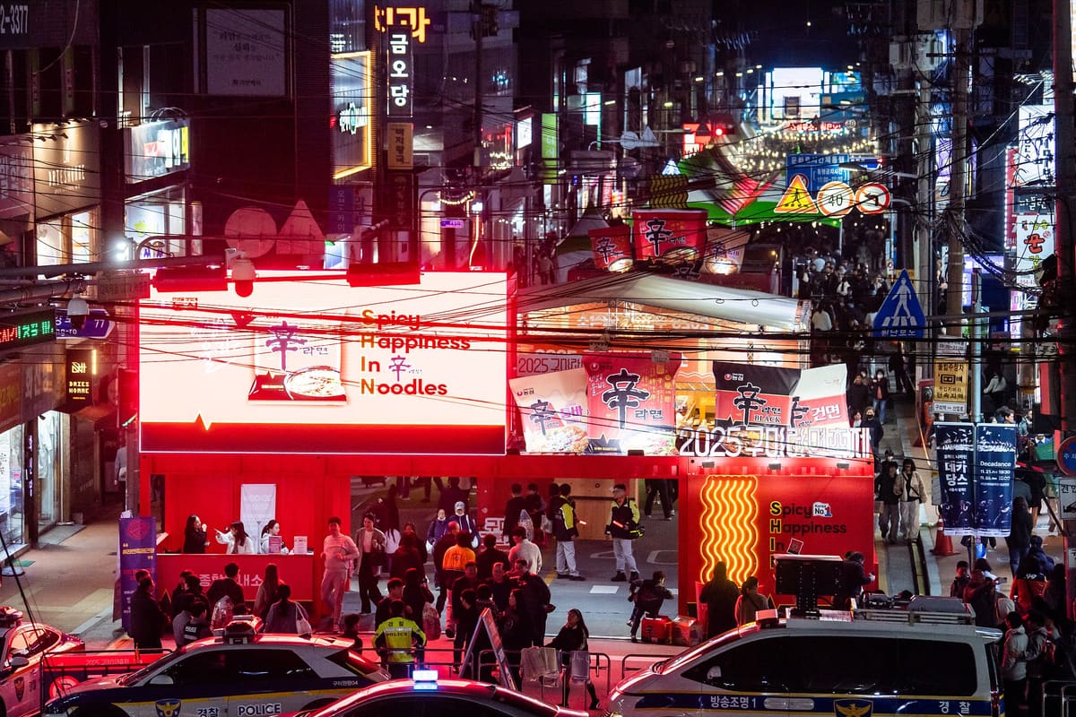 The festival street lit up at night, 2025