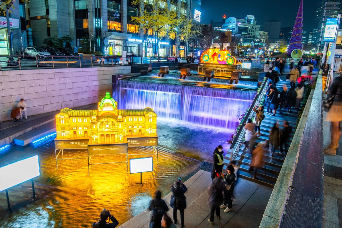 A golden lantern of a domed old building beside the waterfall at the head of Cheonggyecheon, where the lantern walk begins