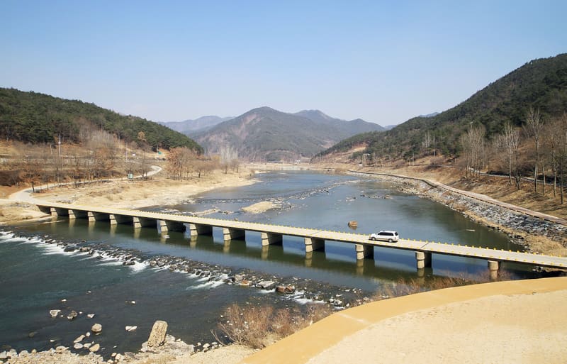 The Seomjingang River winding between hills in Gokseong County, where the festival is held