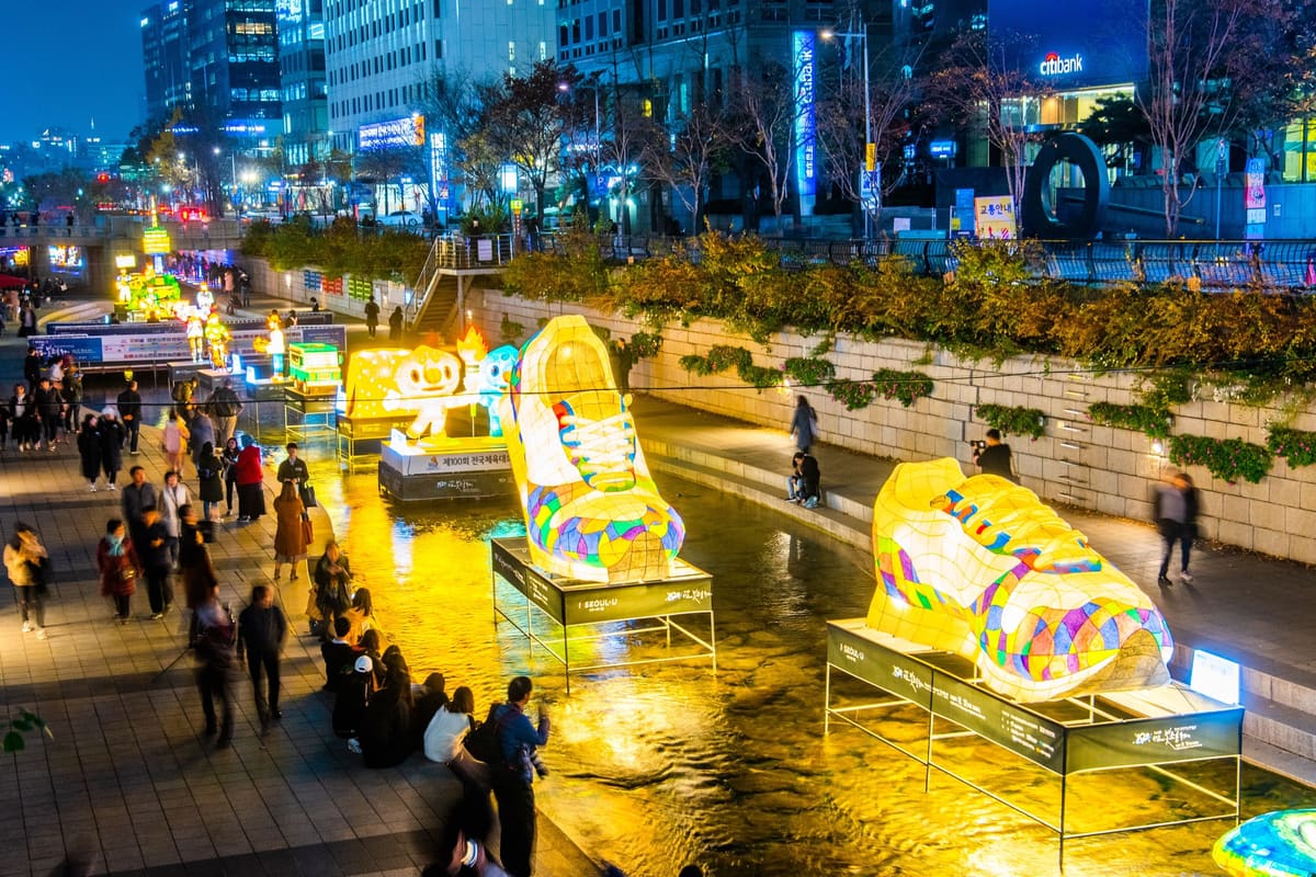 Giant sneaker-shaped lanterns lit up in Cheonggyecheon stream during the Seoul Lantern Festival